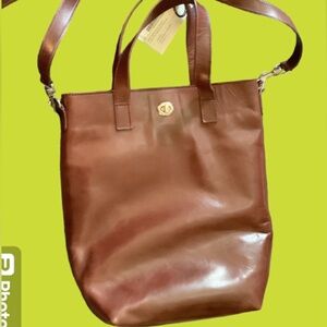 Large Day Bag w/detachable shoulder strap that also adjust. Large pockets NWT